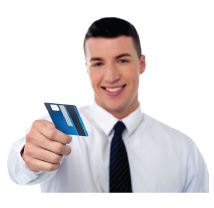 A man reaching out a debit card (Links to Hicksville Debit and ATM card page.)